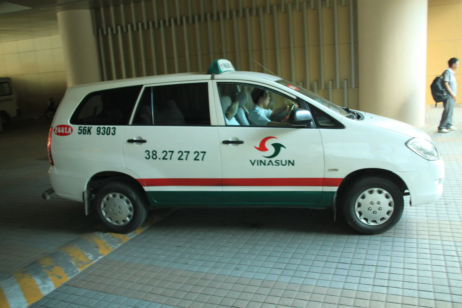 Hvit Vinasun-taxi i Ho Chi Minh-byen